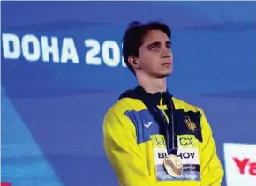  ?? REUTERS PIC ?? Vladyslav Bukhov on the podium at the World Championsh­ips in Doha, Qatar, on Saturday.