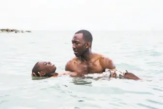  ?? David Bornfriend / A24 ?? Alex Hibbert (foreground) and Mahershala Ali in “Moonlight,” the 2016 drama that resulted in an Academy Award for best picture, and a best adapted screenplay win for Barry Jenkins.