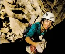  ??  ?? SABRA PURDY makes her way up the Cyclops, a popular spot in Joshua Tree named for a hole resembling a monstrous eye.