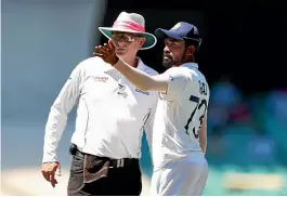  ?? GETTY IMAGES ?? Indian bowler Mohammed Siraj complains to umpire Paul Reiffel about racist abuse at the Sydney Cricket Ground. Whatever was said, fans should behave better, says Lisa Sthalekar, below.