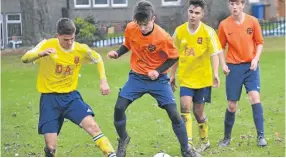  ??  ?? Ferry U/17s (yellow) finished their year with a hard-fought 1-0 victory over Fairmuir to book a last-four spot in the East Region Cup.