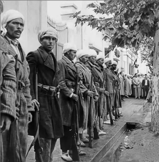  ??  ?? Harki volunteer fighters in Algeria in 1956. Six years later the French abandoned them to their fate (AFP/Getty)