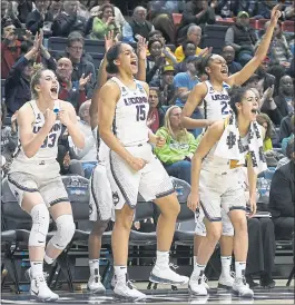  ?? JESSICA HILL — THE ASSOCIATED PRESS ?? From left, UConn’s Katie Lou Samuelson, Gabby Williams, Kia Nurse and Azura Stevens react to the record-setting rout in the first-round NCAA game against Saint Francis.