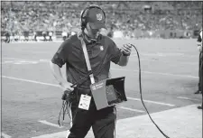  ?? MIKE MCCARN/AP PHOTO ?? An official moves his Microsoft tablet off the field Wednesday after an official review of a play during the second half of the CarolinaHo­uston preseason game in Charlotte, N.C.
