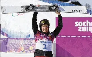  ?? ANDY WONG/ASSOCIATED PRESS ?? Patrizia Kummer celebrates her victory in the women’s snowboard parallel giant slalom event at the 2014 Winter Olympics in Sochi, Russia. She is spending 21 days in isolation in Beijing.