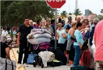  ?? AFP ?? People wait in line to enter the Germain Arena that is serving as a shelter from the approachin­g Irma on Saturday in Florida.—