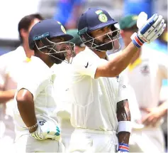  ?? — AFP photo ?? India’s batsman Virat Kohli (right) and teammate Rishabh Pant watch a replay as Kohli is dismissed by Australia on the third day of the second cricket Test match in Perth in this file photo.