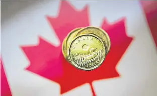  ?? REUTERS/MARK BLINCH/FILE PHOTO ?? The Loonie is pictured in this illustrati­on picture taken in Toronto on Jan. 23, 2015.