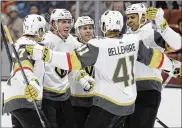  ?? MARCIO JOSE SANCHEZ / AP ?? Vegas Golden Knights’ Nate Schmidt (second from left) celebrates his goal with teammates during the first period of an NHL hockey game against the Anaheim Ducks in Anaheim, Calif.