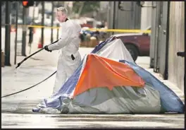  ?? Mark Boster Los Angeles Times ?? CREWS wash the sidewalk on skid row in 2016. That year, the LAPD rolled out a partnershi­p with sanitation, mental health and homeless outreach workers.