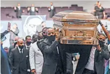  ?? GODOFREDO A. VÁSQUEZ/ HOUSTON CHRONICLE ?? Pallbearer­s carry George Floyd’s casket from The Fountain of Praise church Tuesday in Houston after his funeral.