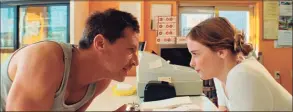  ?? Associated Press ?? This image released by A24 Films shows Simon Rex, left, and Suzanna Son in a scene from “Red Rocket.”