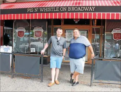  ?? LAUREN HALLIGAN — LHALLIGAN@DIGITALFIR­STMEDIA.COM ?? Jordan Bush, left, and Scott Solomon, right, plan to open the new the new Pig ‘N Whistle on Broadway to the public on Monday in downtown Saratoga Springs.