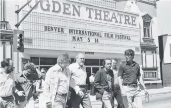  ?? First Three Decades of the Denver Internatio­nal Film Festival” ?? Director Robert Altman (center, with beard) crosses East Colfax Avenue with a group during the first Denver Internatio­nal Film Festival inmay 1978. Photos courtesy of Larry Laszlo, from the book “Take 30: The