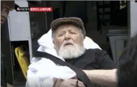  ?? ABC VIA AP ?? In this Monday frame from video, Jakiw Palij, a former Nazi concentrat­ion camp guard, is carried on a stretcher from his home in the Queens borough of New York. Palij, the last Nazi war crimes suspect facing deportatio­n from the U.S. was taken from his home and spirited early Tuesday morning to Germany, the White House said.