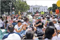  ?? ASSOCIATED PRESS FILE PHOTO ?? Demonstrat­ors sit on April 29, 2017, in front of the White House. The National Park Service is exploring whether it should recoup from protest organizers the cost of providing law enforcemen­t and other support services for demonstrat­ions held in the nation’s capital.