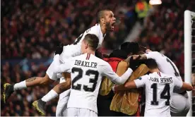  ??  ?? Dani Alves rises highest as PSG players mob Kylian Mbappé after he put their team 2-0 up at Manchester United in their Champions League last-16 1st leg. Photograph: Franck Fife/AFP/ Getty Images