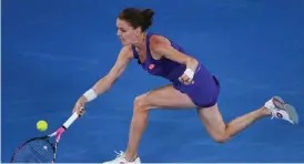  ?? — AFP ?? MELBOURNE: Poland’s Agnieszka Radwanska hits a return against Bulgaria’s Tsvetana Pironkova during their women’s singles match on day two of the Australian Open tennis tournament in Melbourne yesterday.