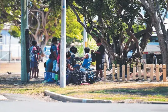  ??  ?? UNDER PRESSURE: People congregati­ng in and around Dean Park are set to be moved on ahead of the opening of North Queensland Stadium.