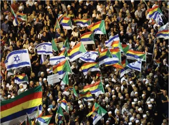  ?? ( Reuters) ?? DRUZE AND their supporters rally in Tel Aviv on Saturday night.