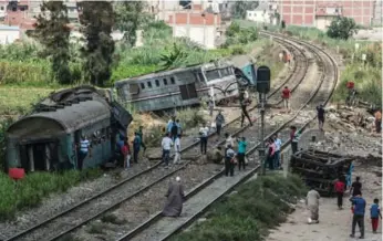  ?? KHALED DESOUKI/AFP/GETTY IMAGES ?? A train from Cairo crashed into the rear of another train waiting at a station near Alexandria, Egypt, on Friday. northern tip of the Suez Canal, when it was hit.
Also Sunday, Egypt’s prosecutio­n ordered the detention of four people, including two...