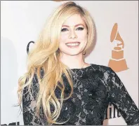  ?? CP PHOTO ?? Avirl Lavigne, seen arriving at the 2016 Clive Davis Pre-Grammy Gala in Beverly Hills, Calif., is the most likely celebrity to land users on websites that carry viruses or malware, according to Cybersecur­ity firm McAfee.