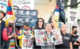  ?? FREDERIC BROWN
AFP VIA GETTY IMAGES FILE PHOTO J. ?? Activists calling for a boycott of the 2022 Beijing Winter Olympics due to concerns over China’s human-rights record rally in front of the Chinese Consulate in Los Angeles in November.