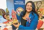  ?? APRIL GAMIZ/THE MORNING CALL ?? Allentown City Council President Cynthia Mota displays items from the Dominican Republic on Tuesday at City Hall.