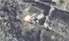  ?? — Reuters photo ?? A still image taken from a video footage released by Russia’s Defence Ministry shows a missile hitting a target, which the ministry said was a terrorists’ position in Idlib province, Syria.