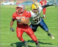  ?? File photo by John Gleeson ?? Bristol RB Donte Simmons eludes Morrisvill­e tackler Gary Boyd in last year’s Thanksgivi­ng Day clash with the Bulldogs. The annual rivalry game was cancelled due to the Warriors’ ongoing state playoff campaign.