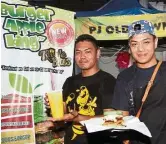  ??  ?? Farid (left) and Azwan run the Apple Burger King night stall in PJ Old Town. Farid also helps to sell mango juice in the day. — AZLINA ABDULLAH/The Star