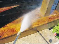  ?? STEVE MAXWELL ?? A pressure washer is the best tool to use for removing the finish of an old deck softened by a water-soluble deck stripper.