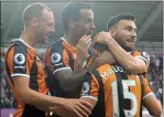  ??  ?? LITTLE HERO: Maloney is mobbed after his opener for Hull