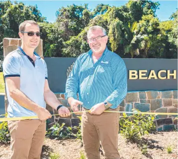  ??  ?? Seymour Group director Daniel Farquhar and Douglas Shire Mayor Michael Kerr cut the ribbon at The Beach Estate, Port Douglas. Picture: Alison George.