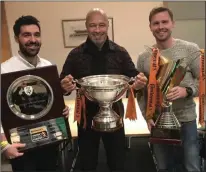  ??  ?? The great Paul McGrath (centre) with the silverware won by Wexford Youths Women this season.