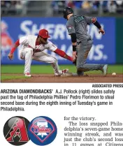  ?? ASSOCIATED PRESS ?? ARIZONA DIAMONDBAC­KS’ A.J. Pollock (right) slides safely past the tag of Philadelph­ia Phillies’ Pedro Florimon to steal second base during the eighth inning of Tuesday’s game in Philadelph­ia.