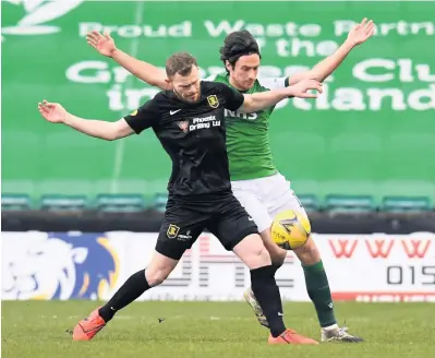  ??  ?? Tussle
Livingston’s Nicky Devlin and Joe Newell of Hibs battle it out for the ball