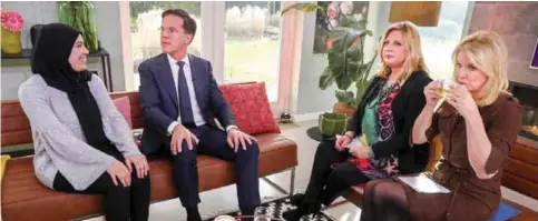  ?? —AFP ?? EEMNES: Prime Minister and VVD-leader Mark Rutte, 3rd right, attends the tv show Koffietijd with Loretta Schrijver, 2nd right, and Pernille La Lau, 1st right, in Eemnes, yesterday.