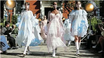  ?? Picture: REUTERS / HENRY NICHOLLS ?? Models present creations during the Bora Aksu catwalk show at London Fashion Week 2020, in London, Britain, on Friday.