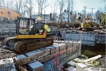  ?? H John Voorhees III/Hearst Connecticu­t Media ?? A temporary bridge, allowing one lane of alternatin­g traffic, has been installed on Lovers Lane as part of the project replacing the existing bridge on the road. The project is expected to be completed this summer.