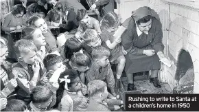  ??  ?? Rushing to write to Santa at a children’s home in 1950