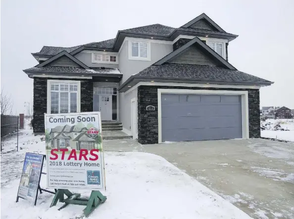  ??  ?? The 2,884-square-foot Carlisle home has a foyer with an 18-foot vaulted ceiling and extensive windows throughout to let in natural light.