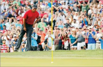 ?? The Associated Press ?? Tiger Woods reacts as his chip comes up just short on the 15th hole during the final round of the Valspar Championsh­ip golf tournament Sunday in Palm Harbor, Fla.