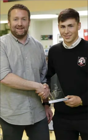  ??  ?? Mr Bergin presents Luke Clucas with the Sportspers­on of Year Award.