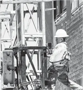  ?? KEVIN RICHARDSON/BALTIMORE SUN ?? Constructi­on work continues at Port Covington as viewed from below.