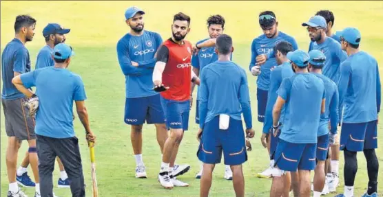  ?? AFP ?? India captain Virat Kohli interacts with teammates during a training session in Chennai ahead of the first ODI against Australia on Sunday.