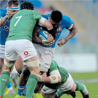  ?? Picture: GETTY IMAGES/PAOLO BRUNO ?? FRONT-LINE WARRIOR: Italy’s Maxime Mbanda is tackled during the Guinness Six Nations match against Ireland at Stadio Olimpico last year. Mbanda is being honoured for his work fighting the virus