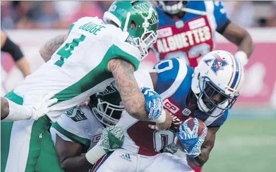  ?? PAUL CHIASSON/ CANADIAN PRESS ?? The June 22 season opener between Cameron Judge and the Saskatchew­an Roughrider­s and Stefan Logan and the Alouettes in Montreal wasn’t a sellout.