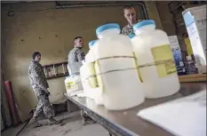  ?? Ryan Garza / Associated Press ?? In this Jan. 18, 2016 file photo, water analysis test kits for Flint, Mich., residents to pick up for lead testing their drinking water are set out on a table at Flint Fire Department Station No. 1 in Flint.