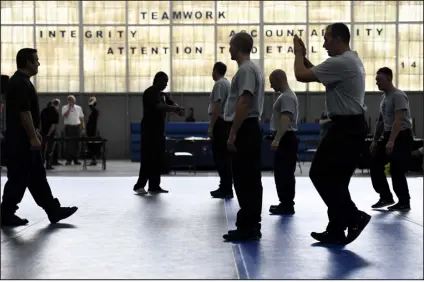  ?? JOE AMON — DENVER POST FILE ?? Officers participat­e in a training exercise at the Denver Police Department’s academy in 2017. Mayoral candidates have offered public safety solutions ranging from adding 400 more police officers to expanding non- police responses to 911 calls.